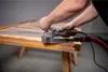 A person is using a Metabo Lackfräse LF 850 S to sand a wooden door frame. Anteprima dell’immagine prodotto