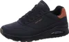 A black Skechers sports shoe with brown accents is shown from the side against a white background. Produktbild-Vorschau
