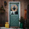 A decorated door with a wreath and Christmas trees. Produktbild-Vorschau