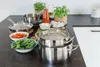 A collection of kitchen cookware and ingredients arranged on a countertop. Produktbild-Vorschau