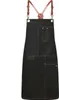 A black apron with brown leather straps is displayed against a white background. Produktbild-Vorschau