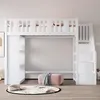 A white loft bed with stairs and storage is shown in a room with a pink ottoman and a round rug on the floor. Produktbild-Vorschau