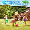 Children playing with water balloons in a grassy yard. Produktbild-Vorschau