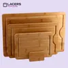 A set of four nested bamboo cutting boards with a small stand. Produktbild-Vorschau