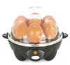 A close-up studio shot of a black and clear egg cooker filled with brown eggs. Náhľad obrázku produktu