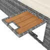 A close-up view of a section of a rattan garden lounger, showing a wooden pull-out table with a cutout. Anteprima dell’immagine prodotto