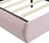 A close-up view of the corner of a pink upholstered bed frame, showing the wooden slats and metal frame. Podgląd zdjęcia produktu