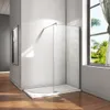 A modern walk-in shower enclosure with a glass panel and a white shower tray, set against a white wall and wooden floor, with a window showing a lush green outdoor view. Produktbild-Vorschau