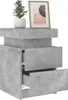A concrete-effect nightstand with two drawers, topped with a potted plant and a framed picture. Produktbild-Vorschau
