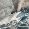A close-up view of a fabric with a leaf pattern. Produktbild-Vorschau