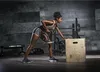 A woman is performing a dumbbell row exercise in a gym. Náhľad obrázku produktu