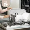 A person is loading dishes into a dishwasher. Voir les images du produit