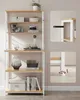 A white and wood shelving unit with various decorative items on its shelves. Náhled obrázku produktu