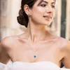 Ensemble collier en or avec cristal bleu et boucles Voir les images du produit 4
