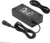 A black battery charger with two cables is shown on a white background. Podgląd zdjęcia produktu