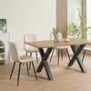 A dining table with four chairs in a well-lit room. Náhled obrázku produktu