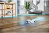 A robot vacuum cleaner is cleaning a wooden floor in a modern home. Produktbild-Vorschau