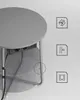A round side table with integrated power outlets and USB ports, shown from a slightly elevated angle. Produktbild-Vorschau