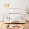 A child's bed with a house-like frame, decorated with bedding and a rug on the floor. Produktbild-Vorschau