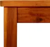 A close-up view of the corner of a wooden table. Náhled obrázku produktu