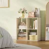A bedroom scene with a cube shelf unit filled with decorative items and folded textiles. Produktbild-Vorschau