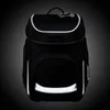 A black ergobag backpack with reflective accents, shown against a dark, gradient background. Produktbild-Vorschau