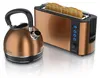 A copper-colored electric kettle and a copper-colored toaster with two slices of toast are shown side-by-side on a white background. Náhľad obrázku produktu