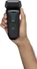 A hand holding a black electric shaver. Anteprima dell’immagine prodotto