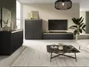 A modern living room with a black sideboard, a tall cabinet, a TV stand, and a coffee table. Produktbild-Vorschau