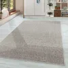 A rug is placed on a light-colored floor in a room with cabinets and a window. Produktbild-Vorschau
