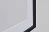 A close-up view of a framed picture with a white mat and a black frame. Produktbild-Vorschau