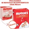 Two packages of Huggies diapers are shown, one pink and one red, with promotional text and images of babies. Náhľad obrázku produktu