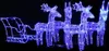 A lit-up Christmas decoration of reindeer and a sleigh against a black background. Podgląd zdjęcia produktu
