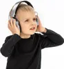 A young boy wearing black long-sleeved shirt and headphones. Voir les images du produit