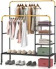 A double-tiered garment rack with clothes hanging on it and shelves with folded clothes and a storage box. Anteprima dell’immagine prodotto