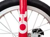 A close-up view of a red unicycle's front fork and wheel. Náhled obrázku produktu