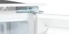 Close-up of a refrigerator door hinge mechanism. Produktbild-Vorschau
