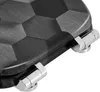 A close-up view of a toilet seat hinge and the textured surface of the seat. Produktbild-Vorschau