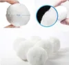 A collage of images showing white filter balls, with one image indicating a size of 5cm. Produktbild-Vorschau