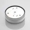 A close-up, top-down view of a round, silver-colored light fixture with a white center and several small screws visible on its surface. Produktbild-Vorschau