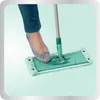 A person's foot is shown pressing down on a mop head. Anteprima dell’immagine prodotto