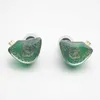 A pair of green in-ear headphones with gold detailing is shown against a white background. Náhľad obrázku produktu