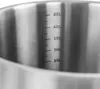 Close-up view of the interior of a stainless steel pot with volume markings. Náhľad obrázku produktu