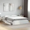 A bedroom scene with a white bed frame and drawers. Podgląd zdjęcia produktu