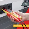 A hand is holding a voltage and continuity tester, with the probes inserted into an electrical outlet. Náhľad obrázku produktu