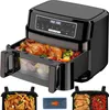 A black air fryer with a transparent drawer showing a whole roasted chicken and vegetables inside. Accessories are shown below. Produktbild-Vorschau