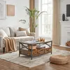 A living room scene featuring a couch, coffee table, and rug. Produktbild-Vorschau