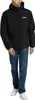 A man wearing a black jacket and blue jeans, standing against a white background. Produktbild-Vorschau