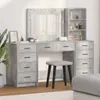 A vanity table set with drawers, a mirror with lights, and a stool, set against a light gray and white background. Náhled obrázku produktu