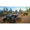 Several monster trucks racing on a dirt track with trees and a blue sky in the background. Produktbild-Vorschau